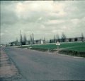 1963-April  Dreux Air Force Base road between work, hospital, post office, stores etc. buildings and officer housing area.