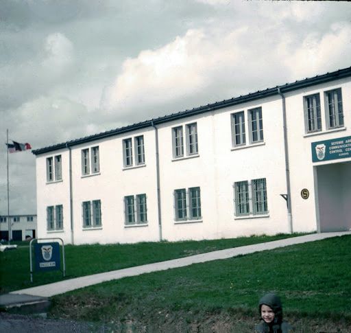 Apr 1963 Michael in front of the building that Charlie worked at on Dreux.jpg