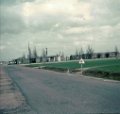 Apr 1963 Dreux Air Force Base road between work, hospital, post office, stores etc. buildings and base housing area.