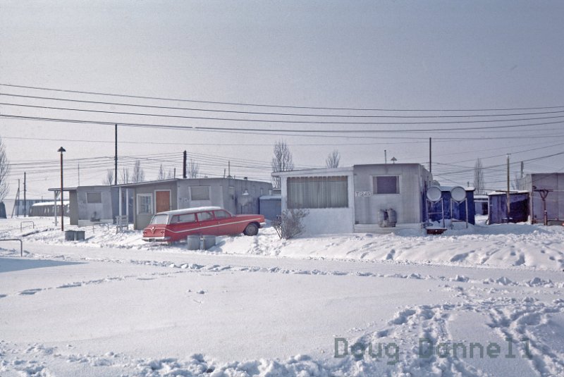 Slides-O021.jpg - Doug"s Trailer- winter 1961, Building 51-BOQ in background