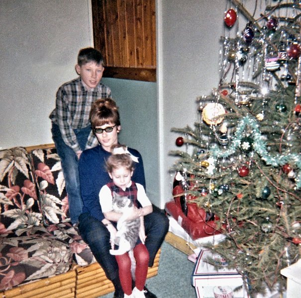 Xmas-SDFZ.jpg - Dec 62 in the trailer with me, our au pair, Marie France, sister Susie, and cat Ziggy.