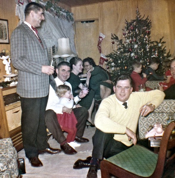 Xmas61-party.jpg - Dec 61 Party at Kendrick's trailer. L to R Col Zahn(DACC commander),My dad (Don Donnell) with sister Susie, Capt Lynn, Virginia Zahn, Charlie Kendrick, misc kids in background