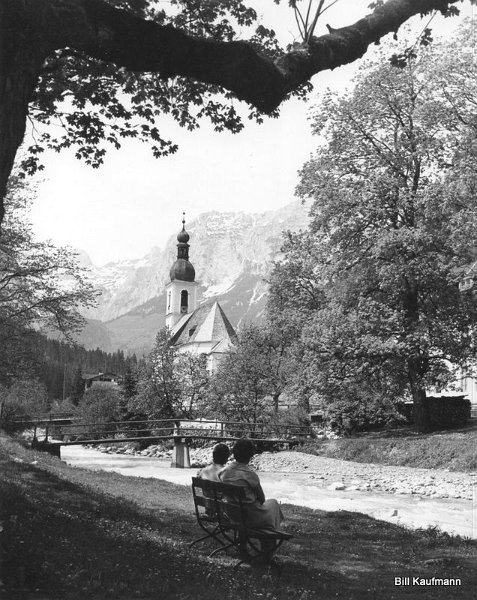 Mountain stream flows past Ramsau Church.jpg