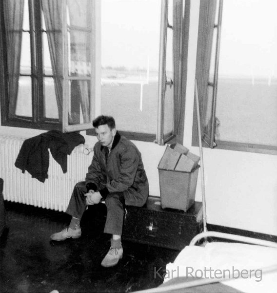 1960 - Dreux AFB - I am sitting in my barracks - base football field in back ground.jpg